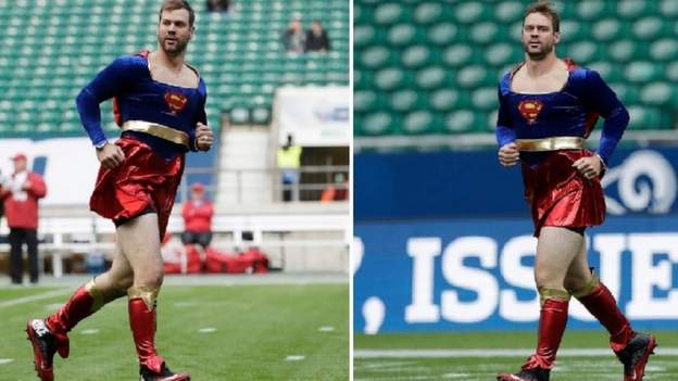 Why a Cardinals QB was forced to warmed up in a Supergirl costume