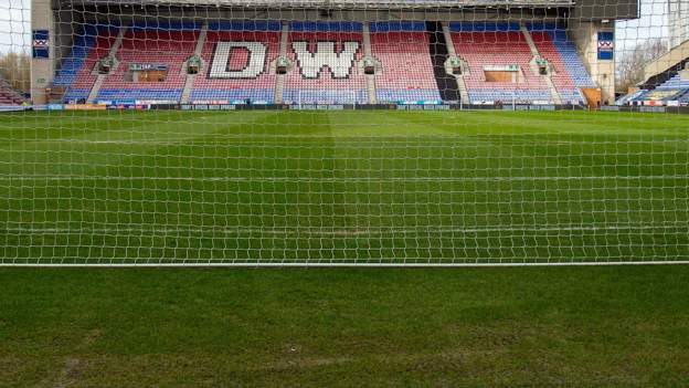 Wigan Athletic: Players paid overdue wages as chief executive Mal Brannigan steps down