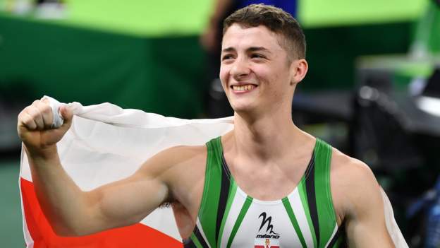 Commonwealth Games: Rhys McClenaghan beats Max Whitlock to ...