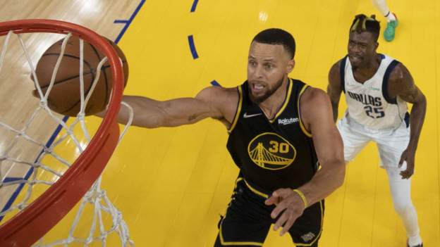 Curry helps Warriors win opener against Dallas
