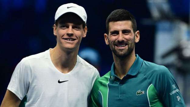 Jannik Sinner and Novak Djokovic pose for a pre-match photo at the net at the ATP Finals