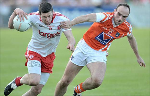 Sean Cavanagh of Tyrone in action against Armagh's Michael O'Rourke