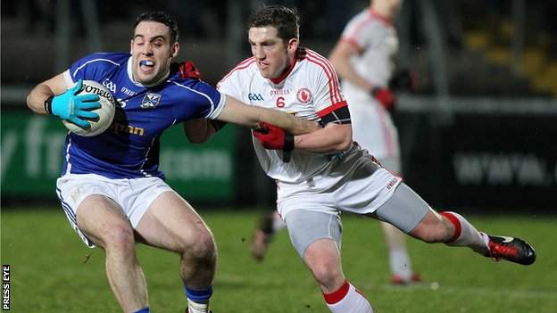 Cavan's Eugene Keating battles with Tyrone's Dermot Carlin in this year's McKenna Cup final