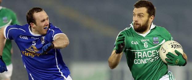 Cavan's Fergal Flanagan gives chase to Fermanagh defender Ryan McCluskey at Brewster Park