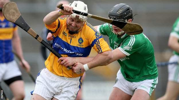 Portaferry goalkeeper Karol Keating battles for possession with Kilmallock's Paddy O'Loughlin