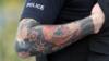 Татуировка на руке полицейского