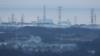 Вид на АЭС Фукусима из соседнего города