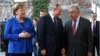Канцлер Германии Ангела Меркель, президент России Владимир Путин и генеральный секретарь ООН Антонио Гутерриш прибывают на международный саммит по обеспечению мира в Ливии, который проходит в Германии