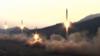 Изображение в государственных СМИ Северной Кореи, на котором запечатлен запуск ракеты