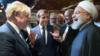 Премьер-министр Великобритании Борис Джонсон (слева), президент Франции Эммануэль Макрон (в центре) и президент Ирана Хасан Рухани (справа) обсуждают на Генеральной Ассамблее ООН в Нью-Йорке 24 сентября 2019 года.