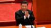 Президент Китая Си Цзиньпин аплодирует во время праздничной встречи