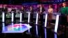 Представители партии стоят на трибуне во время дебатов BBC