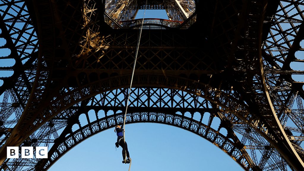 Athlete rope climbs 110m up the Eiffel Tower - BBC Newsround