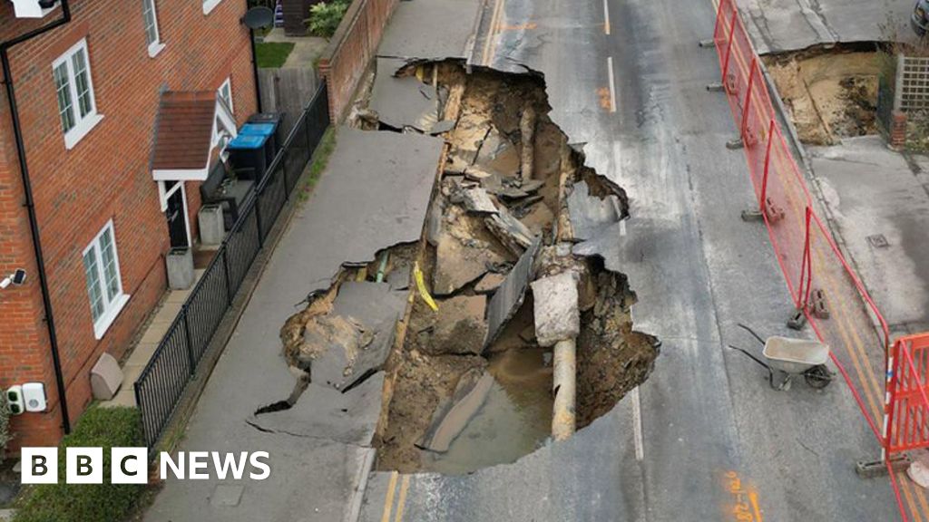 Families return home after sinkhole swallows road