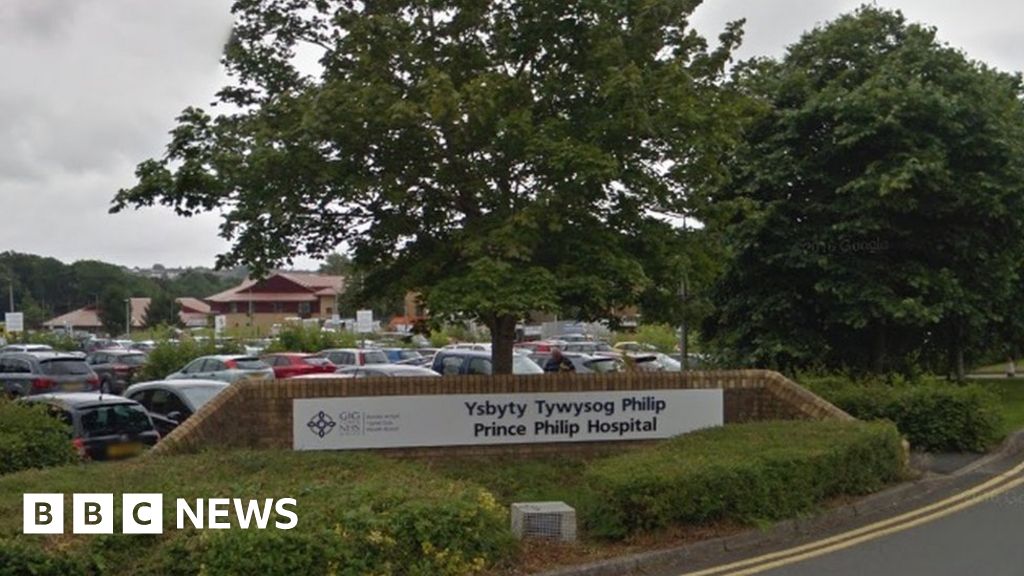 Norovirus closes Prince Philip Hospital in Llanelli to visitors - BBC News