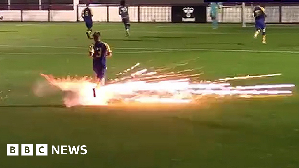 Football match abandoned after firework nearly hits player