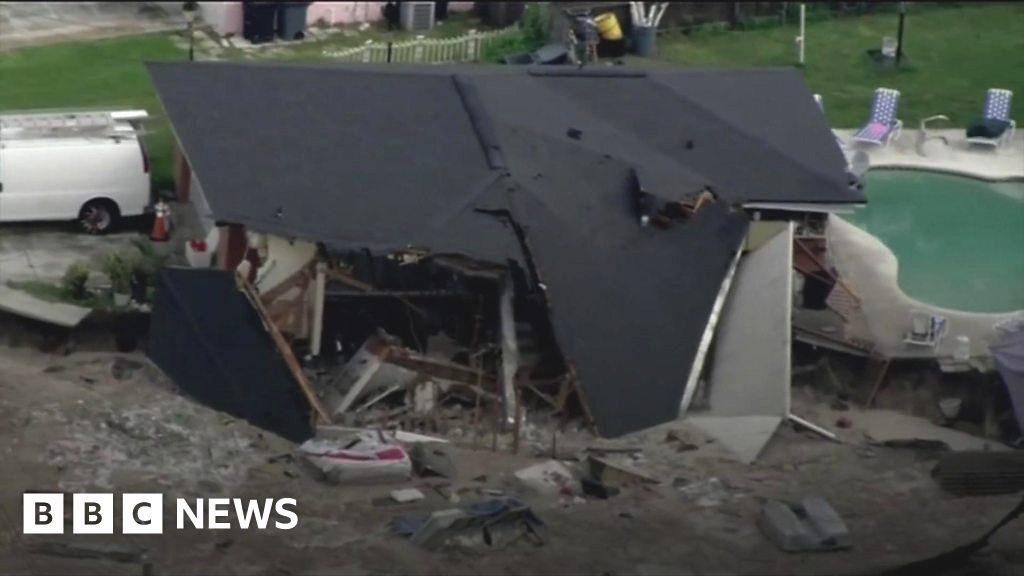 Growing Sinkhole Swallows Two Houses In Florida Bbc News