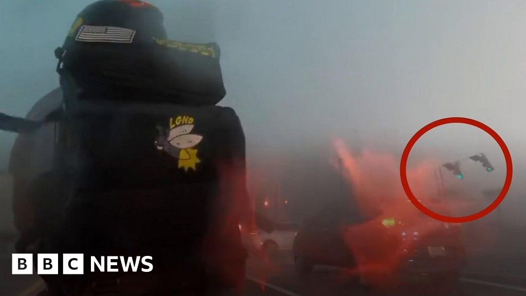 Motorcyclist captured driving through powerful storm