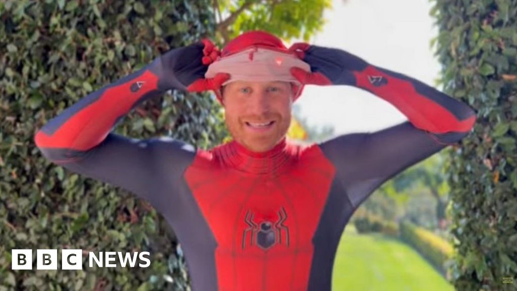 Prince Harry dresses as Spider-Man for Norfolk military charity - BBC News