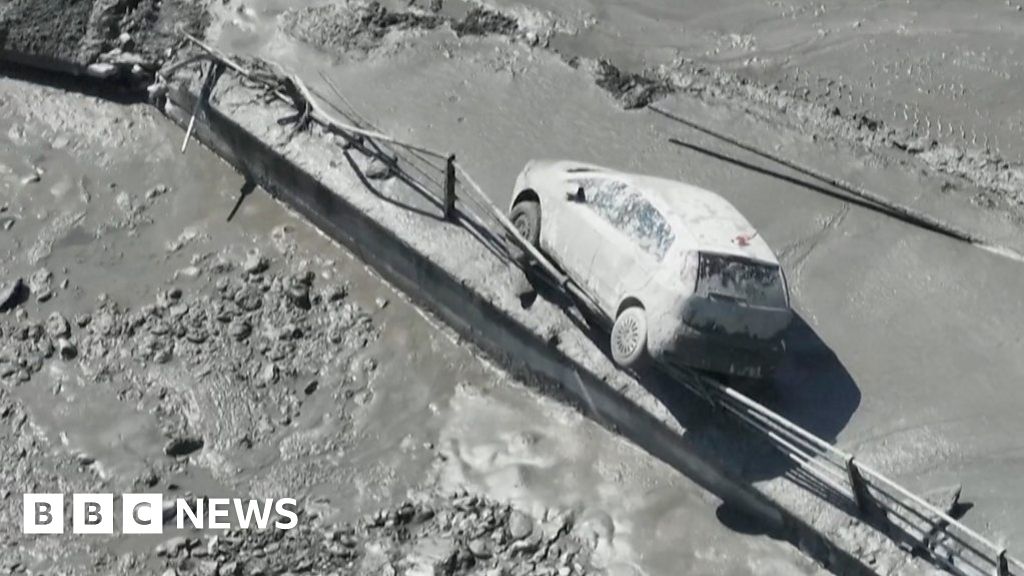 Italy floods: Torrent of muddy floodwater bursts through alpine town