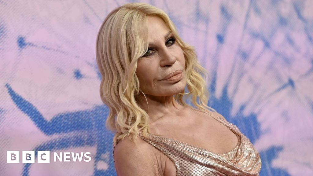 Designer Donatella Versace rescued from lift