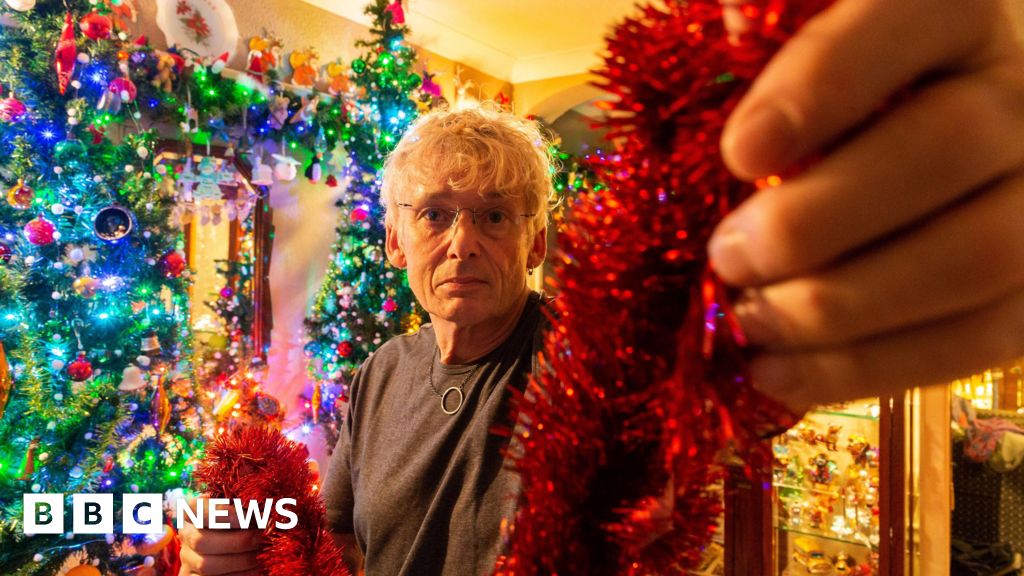 'Britain's most festive man' puts up 25 Christmas trees