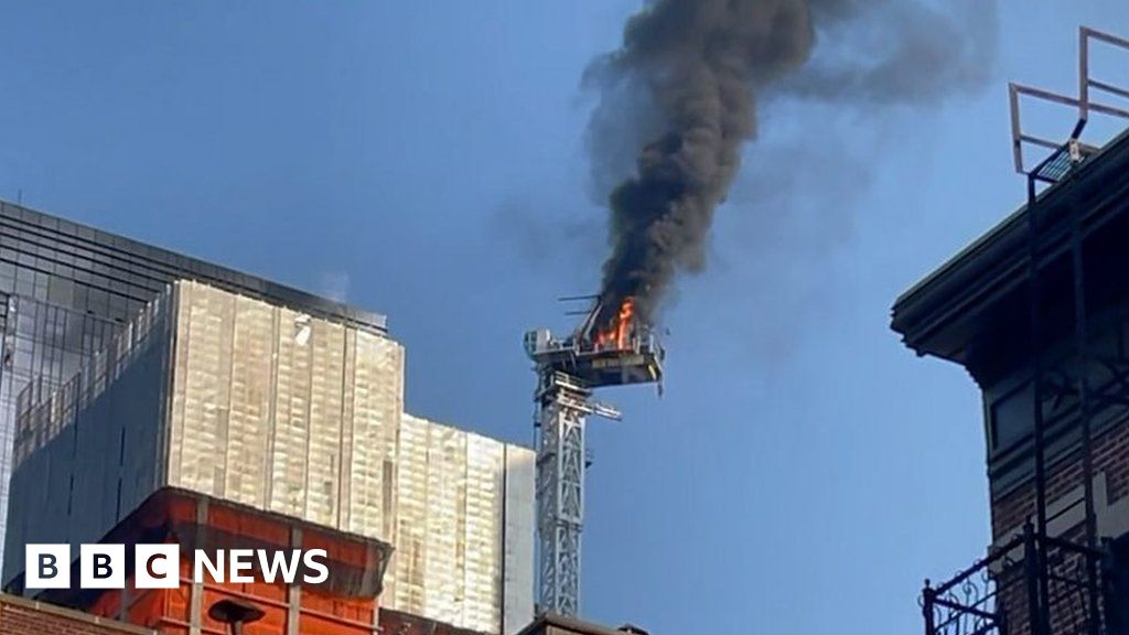 The moment an NYC crane catches fire and collapses