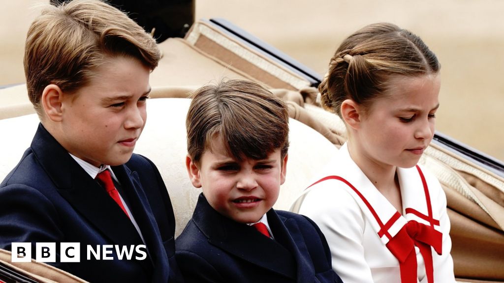 Prince Louis salutes the crowd as grandchildren watch King's first birthday parade