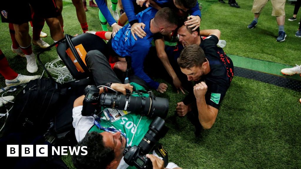 Lensman caught in Croatia victory pile