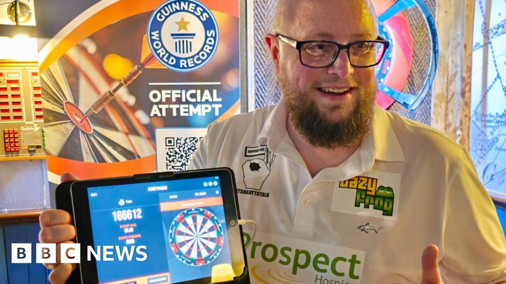 Man completes 12-hour darts world record attempt