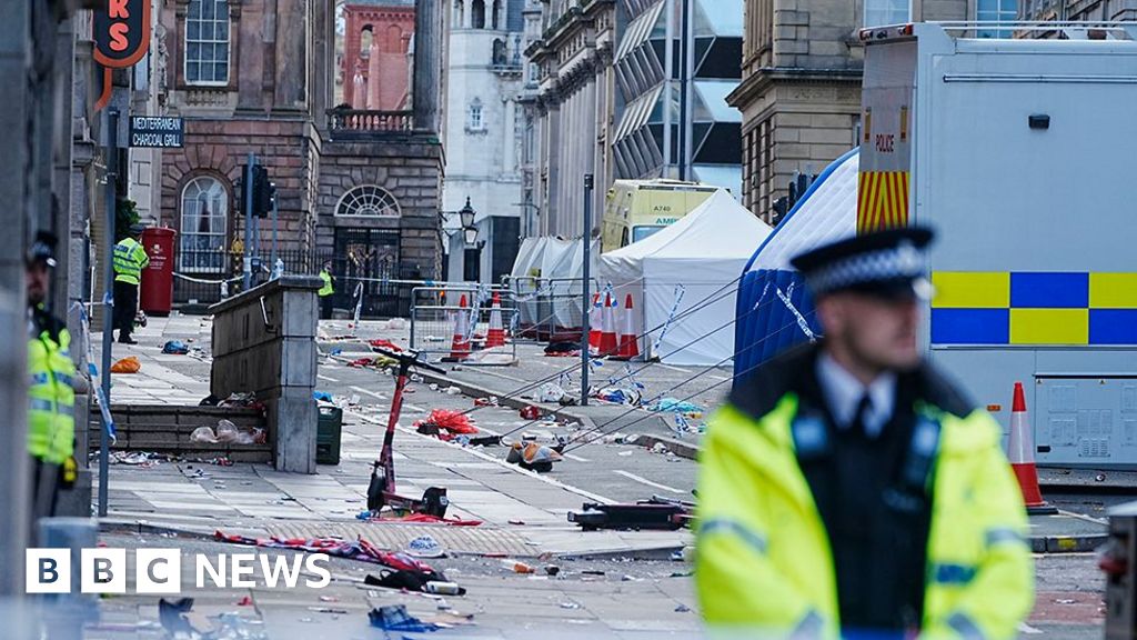 Liverpool Parade Tragedy: Man Arrested After Car Mounts Pavement, Injuring Fans