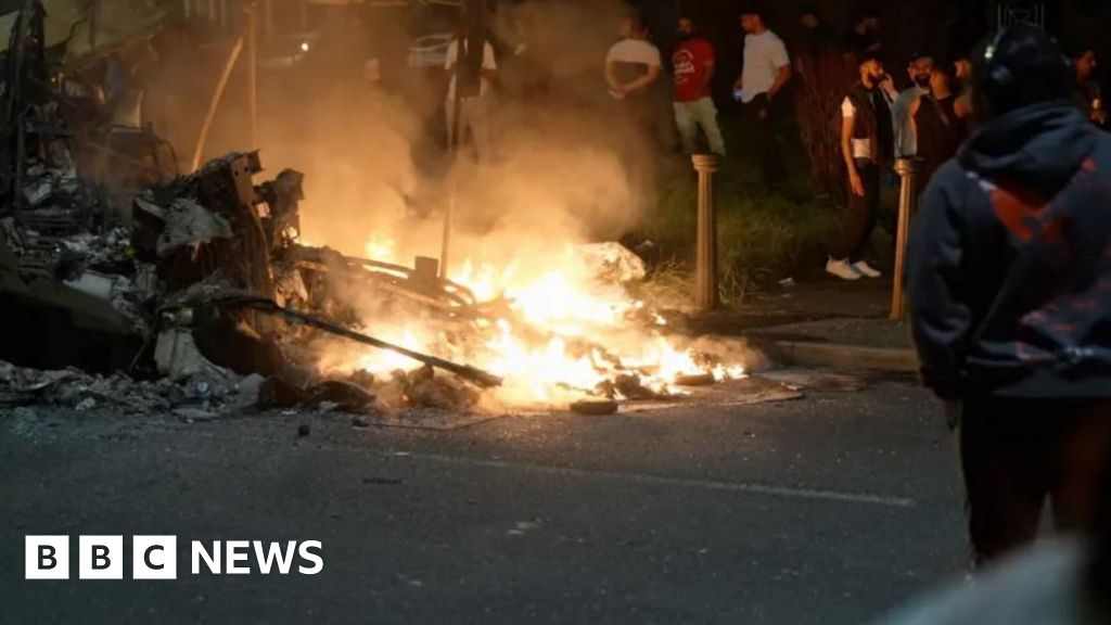 Man charged over torching of Leeds bus