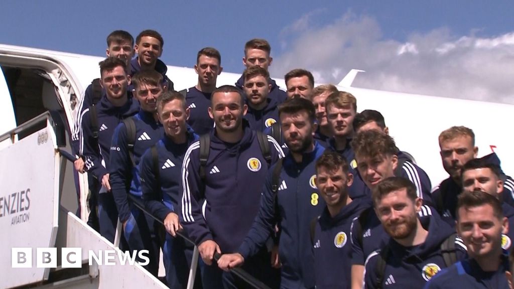 Scotland squad serenaded by piper as they leave for Germany