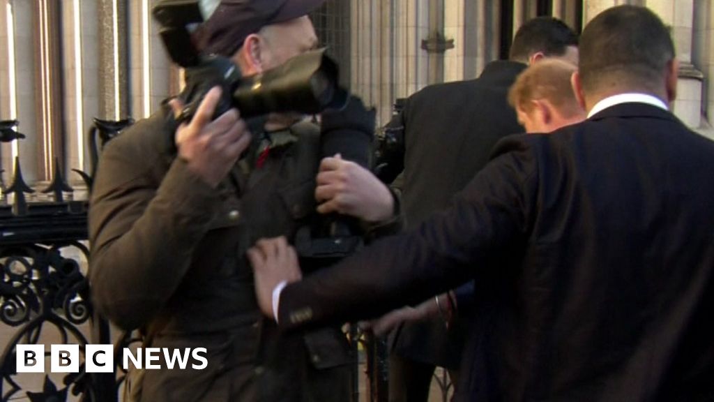 Prince Harry arrives for newspaper phone-tapping High Court hearing