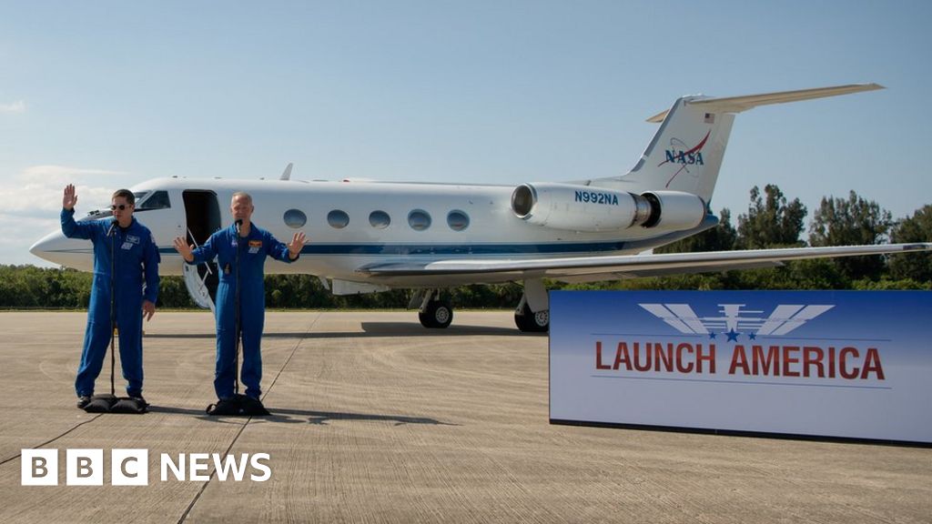 Astronauts get to work ahead of historic flight