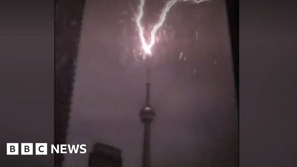 The moment lightning strikes the tip of Toronto's CN Tower