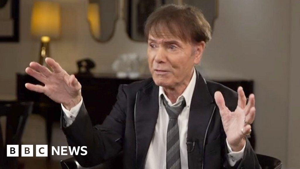 Sir Cliff Richard sings in BBC interview 'without artificial insemination'