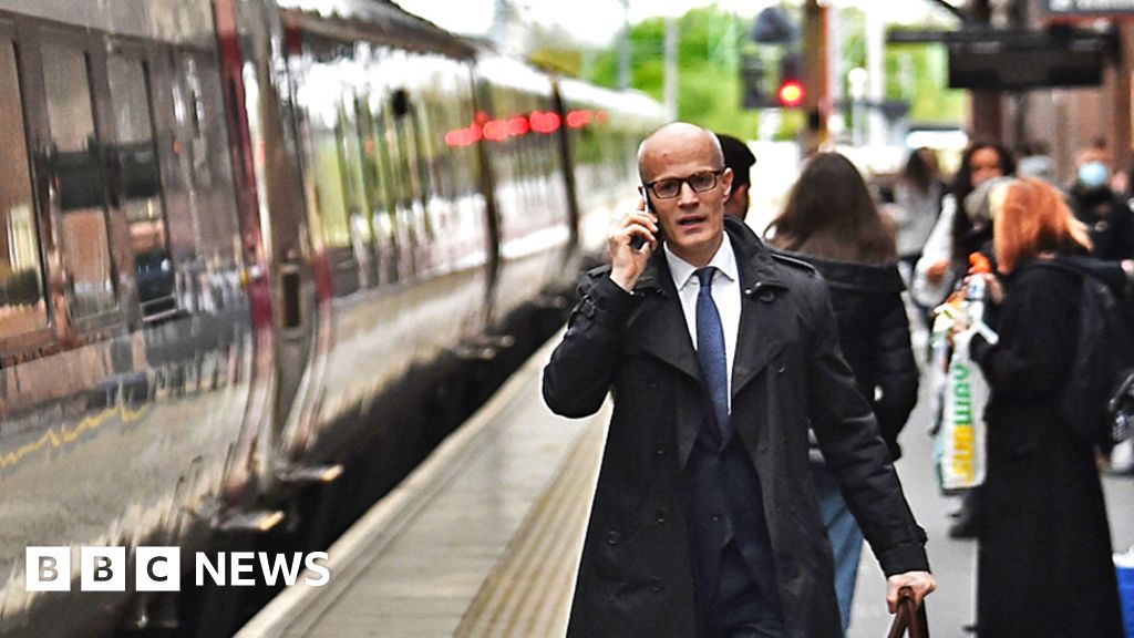 A man makes his way onto a train at Stoke-on-Trent Train Station on 20 May 2021 in Stoke, England