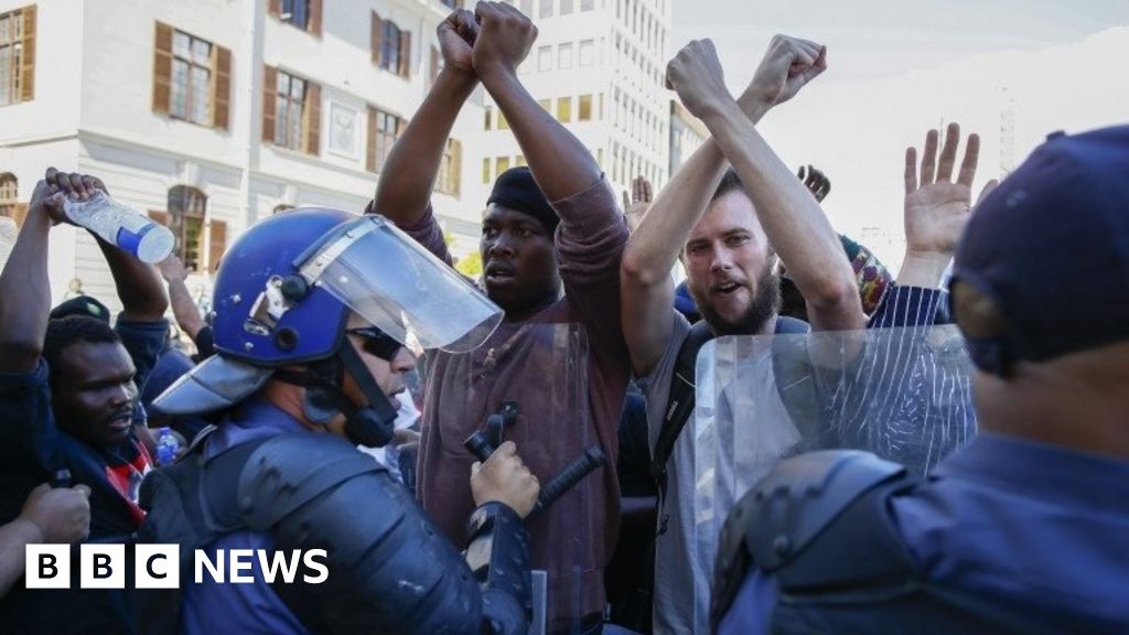 South African students clash with police near parliament - BBC News