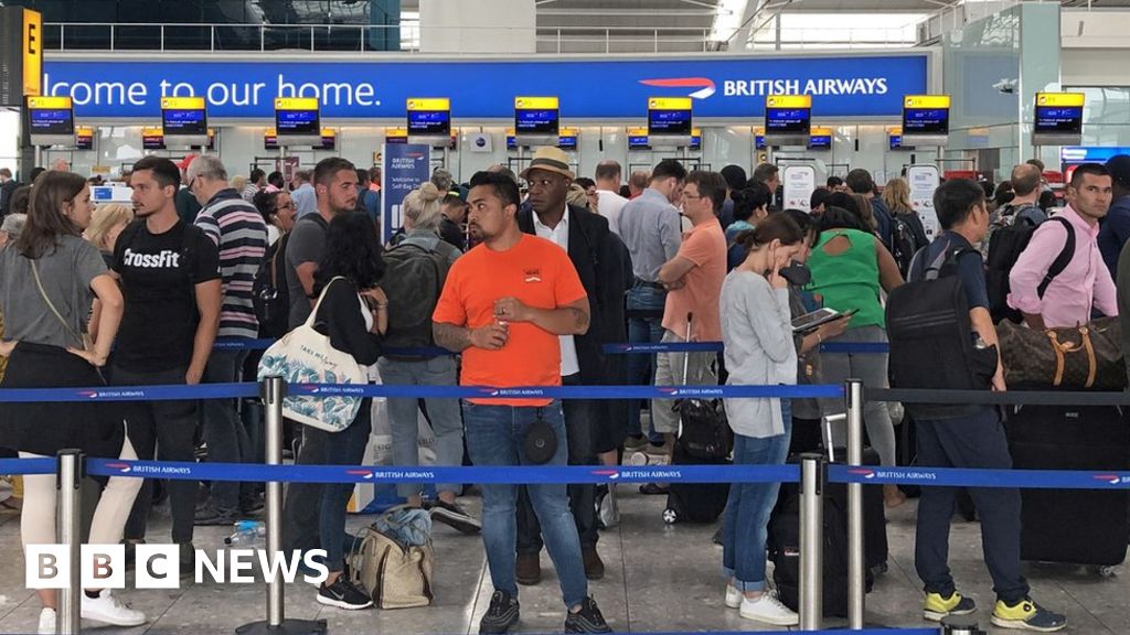 Queues in Terminal 5 at Heathrow airport as the UK"s biggest airport has apologised after extreme weather conditions across Europe caused flight cancellations and delays.