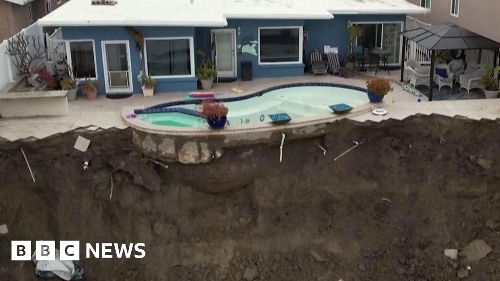Pool dangles off cliff after California landslide