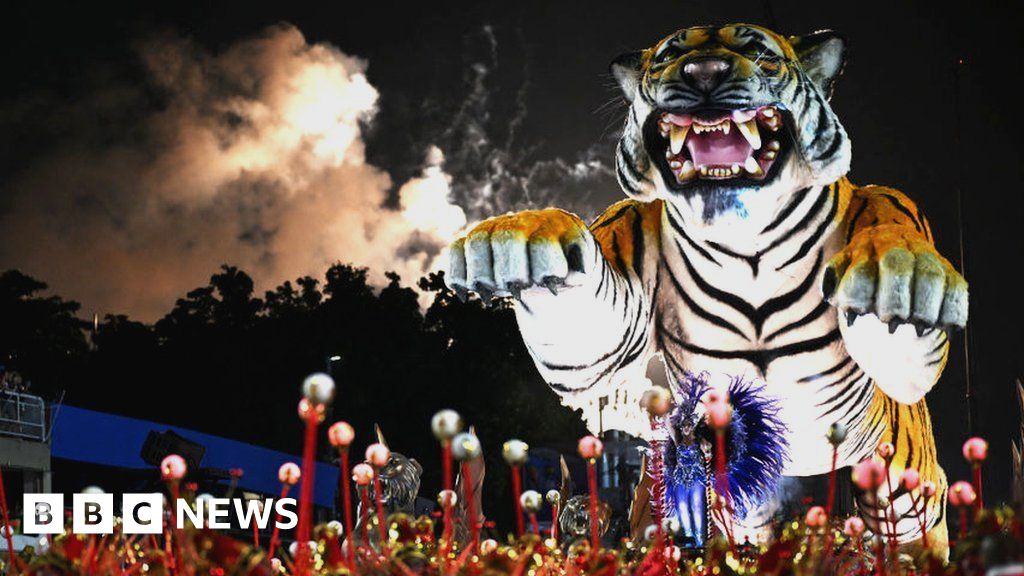 Watch: Fireworks as giant Carnival sculptures roll through Rio