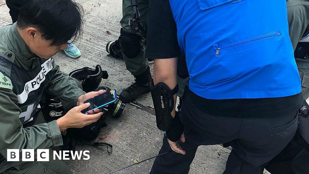 Hong Kong protests: Police officer wounded in leg by arrow