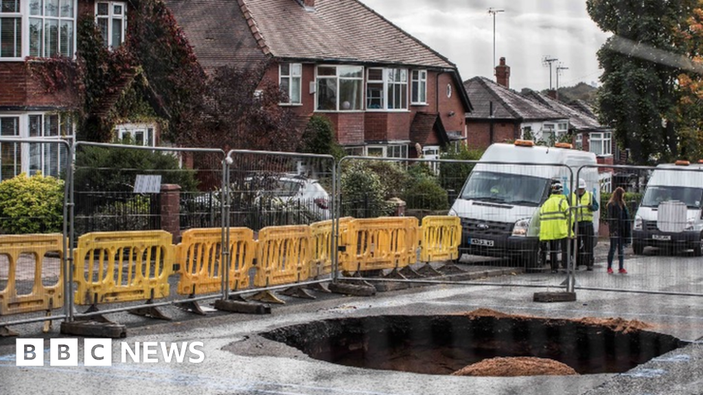 Huge sinkhole caused by collapsed sewer in Prestwich closes road BBC News