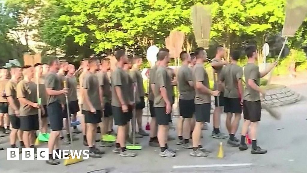 Hong Kong protests: Chinese soldiers clean up streets