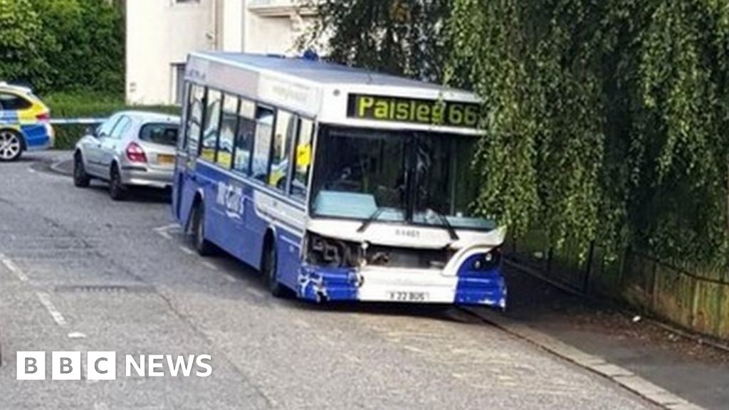 Bus crashes in Paisley after driver falls ill at wheel BBC News