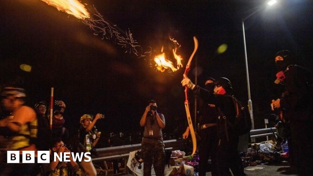 Hong Kong protests: Students fight police with petrol bombs, bows and arrows