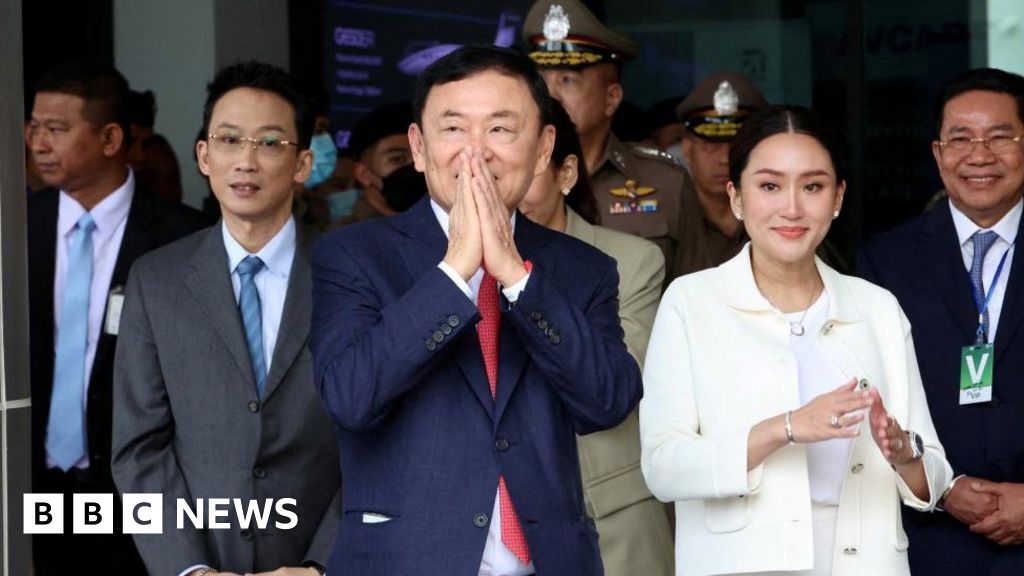 Thaksin: Former Thai PM's prison sentence reduced to a year