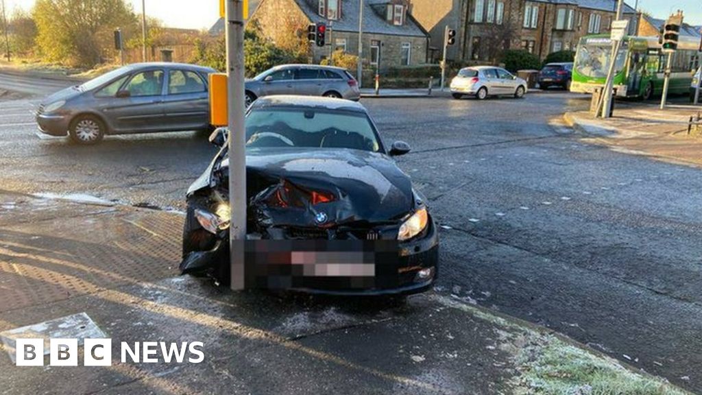 Driver with frosted windscreen crashes into pole