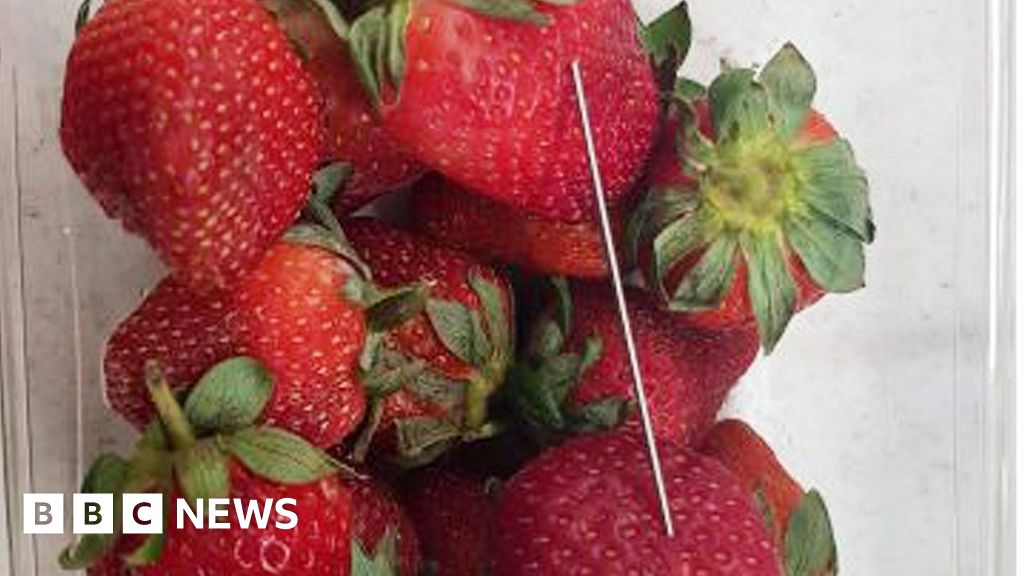 Woman arrested over strawberry needle scare